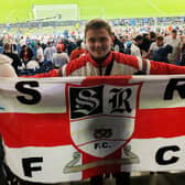 Alex Wickett on tour with England. // An England superfan has taken a gamble and spent £3k to fly out and hopefully see England through to victory at the World Cup. Alex Wickett, 25, joined the England Supporters Travel Club in 2022 and has been building up points going to all the friendlies and qualifiers both at home and away to make tickets more affordable. 