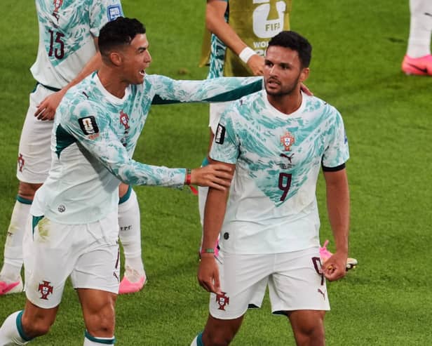 Portugal’s Goncalo Ramos is congratulated by Cristiano Ronaldo after scoring (Sam Balkansky/AP)
