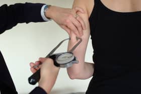 Doctor measuring body fat