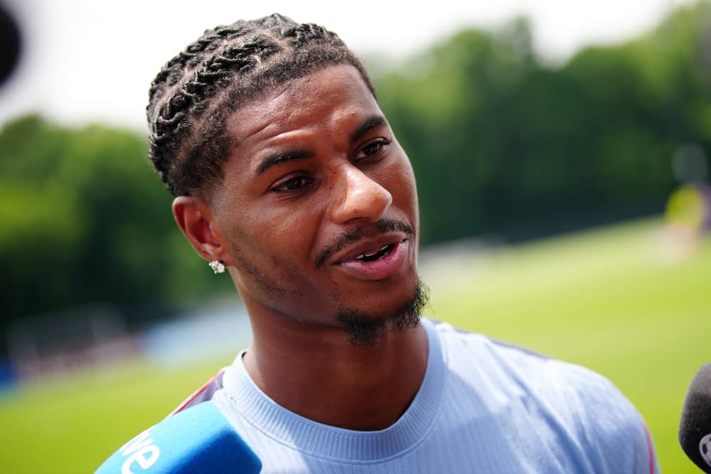 Marcus Rashford speaks to the media