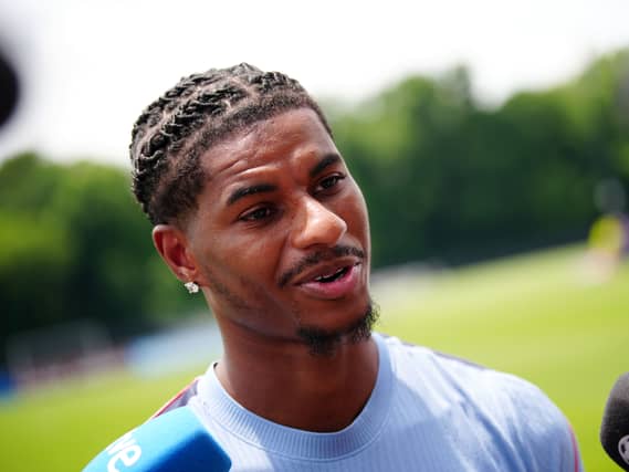 Marcus Rashford speaks to the media