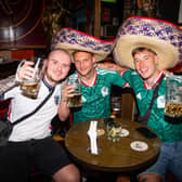 Fans wearing England and Mexico shirts at a bar in Condesa, Mexico City (James Manning/PA)