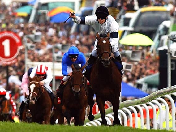 Jockey Johnny Murtagh celebrates winning the Derby on Motivator