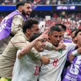 Morocco’s Azzedine Ounahi (centre) is congratulated by team-mates after scoring at the 2026 World Cup