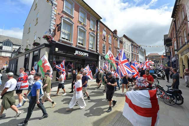 Demonstrators from Shrewsbury Raise the Flags marching through the town earlier this year.