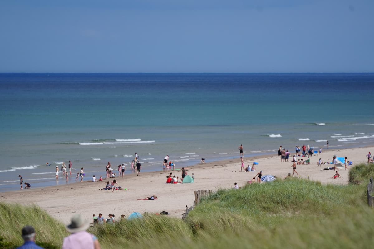 Temperatures of 30C on way as yellow rain warning issued for parts of UK