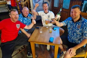 The late hour didn’t dampen the spirits of these England fans in the Crown