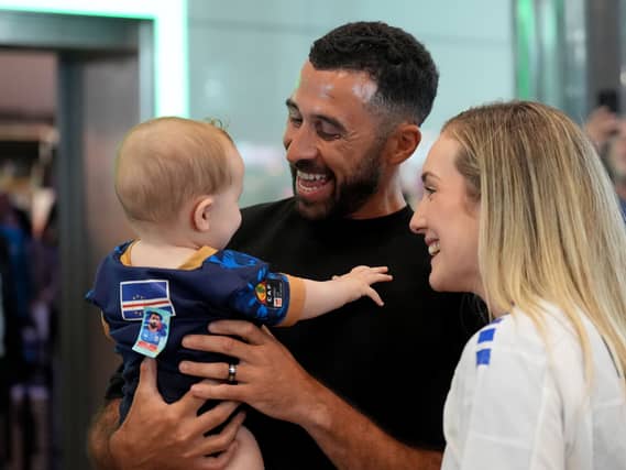 Cape Verde footballer Pico Lopes with his wife Leah and eight-month-old son Diego as he returns home after taking part in the World Cup