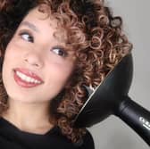 The Curlsmith Defrizzion Hair Dryer includes an extra-large diffuser designed to help define curls while reducing frizz