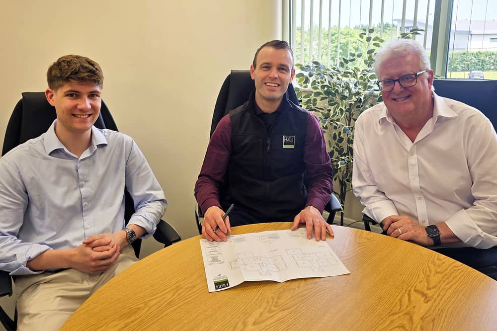 Halls' new recruits Ed Blunt and Dan Callaghan (left and right) with associate director and senior planning consultant Paul Watson
