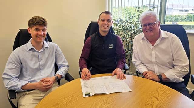 Halls' new recruits Ed Blunt and Dan Callaghan (left and right) with associate director and senior planning consultant Paul Watson