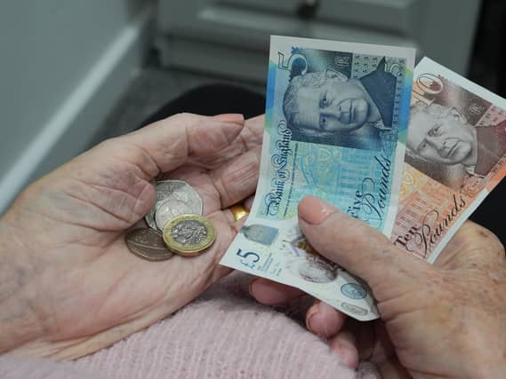 Cash in a person's hand
