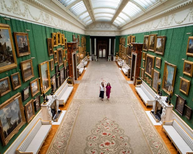 Royal Collection Trust staff with paintings on display in the Picture Gallery at Buckingham Palace, London, which has undergone a once-in-a-generation re-display