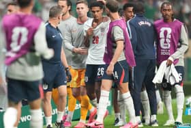 England’s Jarell Quansah, centre, is consoled by team-mates including Jordan Henderson, centre right, and Dean Henderson, centre left, after being shown a red card against Mexico