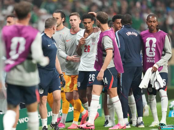 England’s Jarell Quansah, centre, is consoled by team-mates including Jordan Henderson, centre right, and Dean Henderson, centre left, after being shown a red card against Mexico