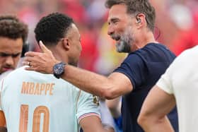 Former Liverpool manager Jurgen Klopp hugs France’s Kylian Mbappe