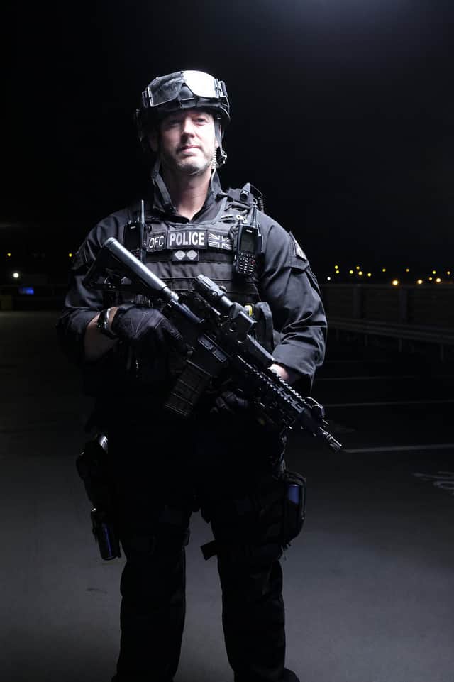 Inspector Roy Teague in firearms gear