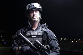 Inspector Roy Teague in firearms gear
