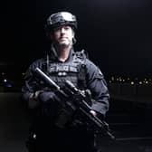 Inspector Roy Teague in firearms gear