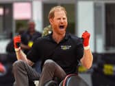 Harry celebrating while taking part in a wheelchair rugby match