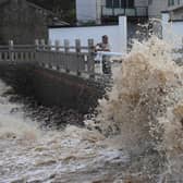 Huge waves crash on the coastline ahead of Typhoon Bavi in Wenling in eastern China’s Zhejiang province