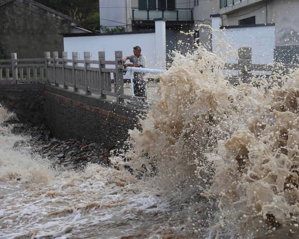 Huge waves crash on the coastline ahead of Typhoon Bavi in Wenling in eastern China’s Zhejiang province