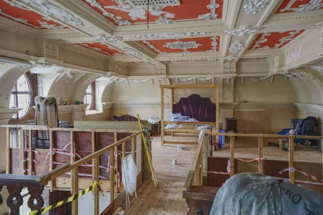A mezzanine walkway links the bathroom area with the main bedroom space.