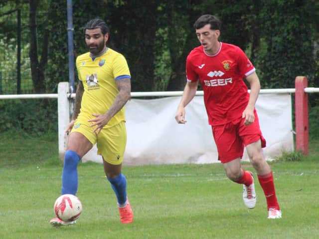 Joel Evans (red shirt) in action for Brecon Corries against Canton in their Elite Stands UK Ardal South East fixture at the Rich Fields