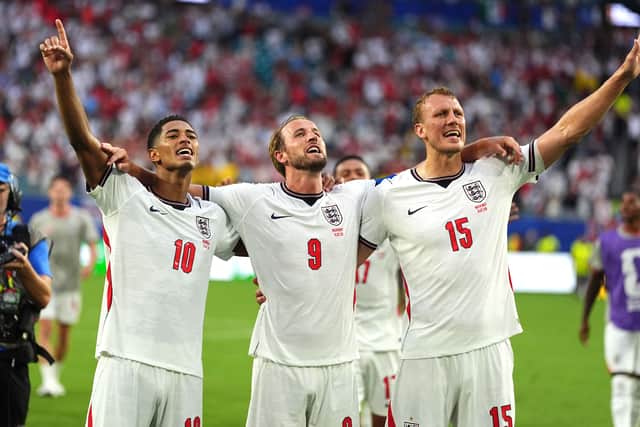 England’s Jude Bellingham, Harry Kane and Dan Burn (Martin Rickett/PA)