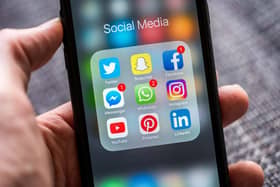Social media app icons displayed on a smartphone
