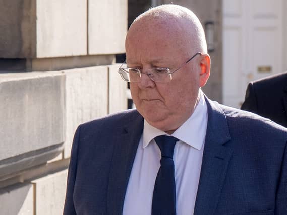 Peter Murrell walking outside court