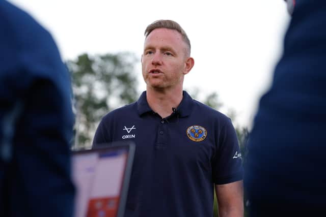 Shrewsbury Town boss Gavin Cowan speaks to the media