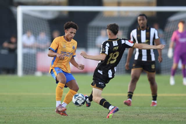 Will Gray (left) in action for Shrewsbury Town at Stafford Rangers