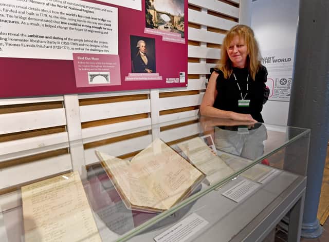 Archivist Sarah Roberts with rare Iron Bridge documents which are on now on display at the Coalbrookdale Museum of Iron.