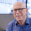 Headshot of Ken Bruce smiling