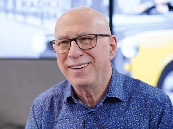 Headshot of Ken Bruce smiling
