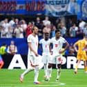 England’s Jude Bellingham (right) reacts after Argentina’s Enzo Fernandez (not pictured) scores t