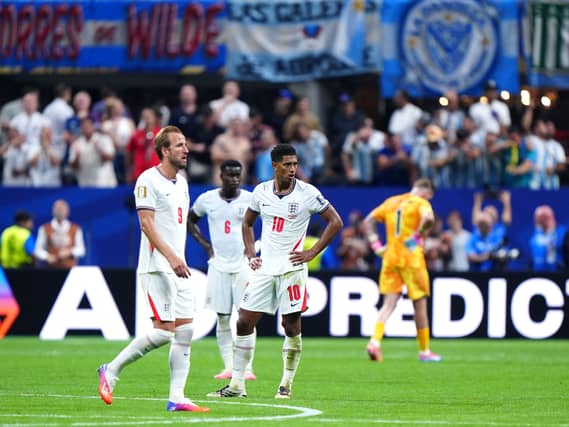 England’s Jude Bellingham (right) reacts after Argentina’s Enzo Fernandez (not pictured) scores t