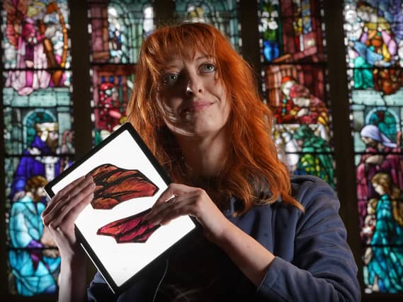 Vivienne Kelly in front of a stained glass window