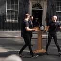 A lectern is moved into position outside 10 Downing Street on June 22 2026, the day Sir Keir Starmer announced his intention to resign as Labour leader and prime minister