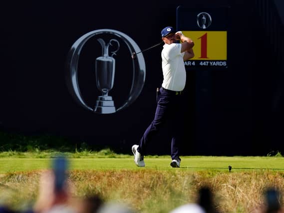 Bryson DeChambeau tees off in front of The Open logo
