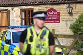 Police outside Johnsons of Old Hurst building
