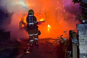 Firefighters tackling the car blaze in Broseley.
