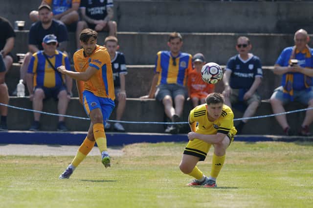 Isaac Fletcher fires at goal for Shrewsbury Town