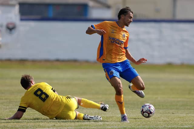 Tom Sang in action for Shrewsbury Town against Radcliffe
