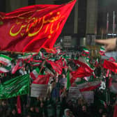 Pro-government demonstrators gather at a square in Tehran