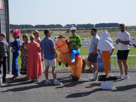 Racegoers in line for a ice cream at The Curragh Racecourse in County Kildare