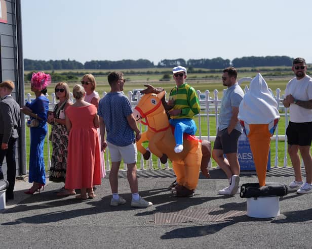 Racegoers in line for a ice cream at The Curragh Racecourse in County Kildare