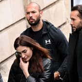 Andrew Tate, left, and his brother Tristan Tate, right, arrive handcuffed and escorted by police at a courthouse in Bucharest in January 2023