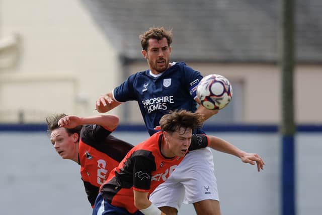 Sam Stubbs battles to win the ball for Shrewsbury Town against FC Isle of Man